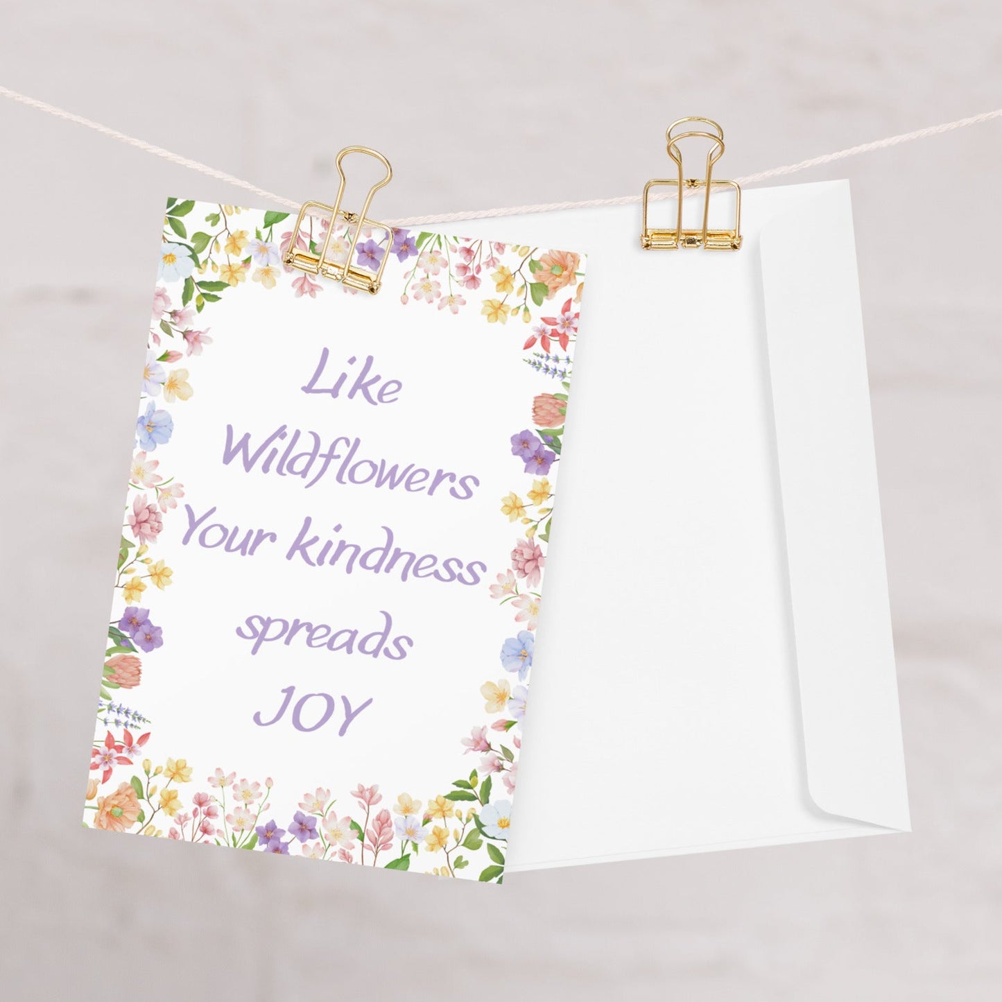 Floral card with text 'Like Wildflowers Your kindness spreads JOY' on a white background