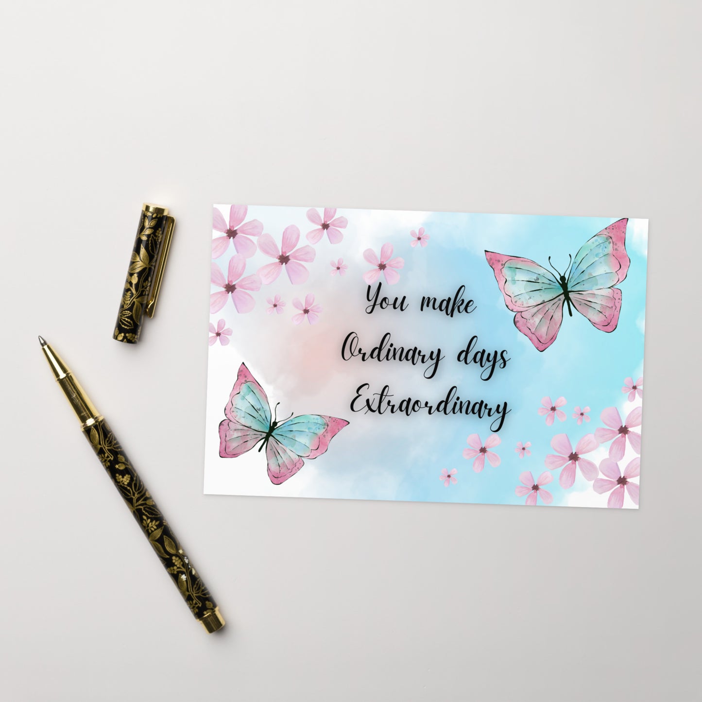 Card with butterflies and flowers on a light gray background