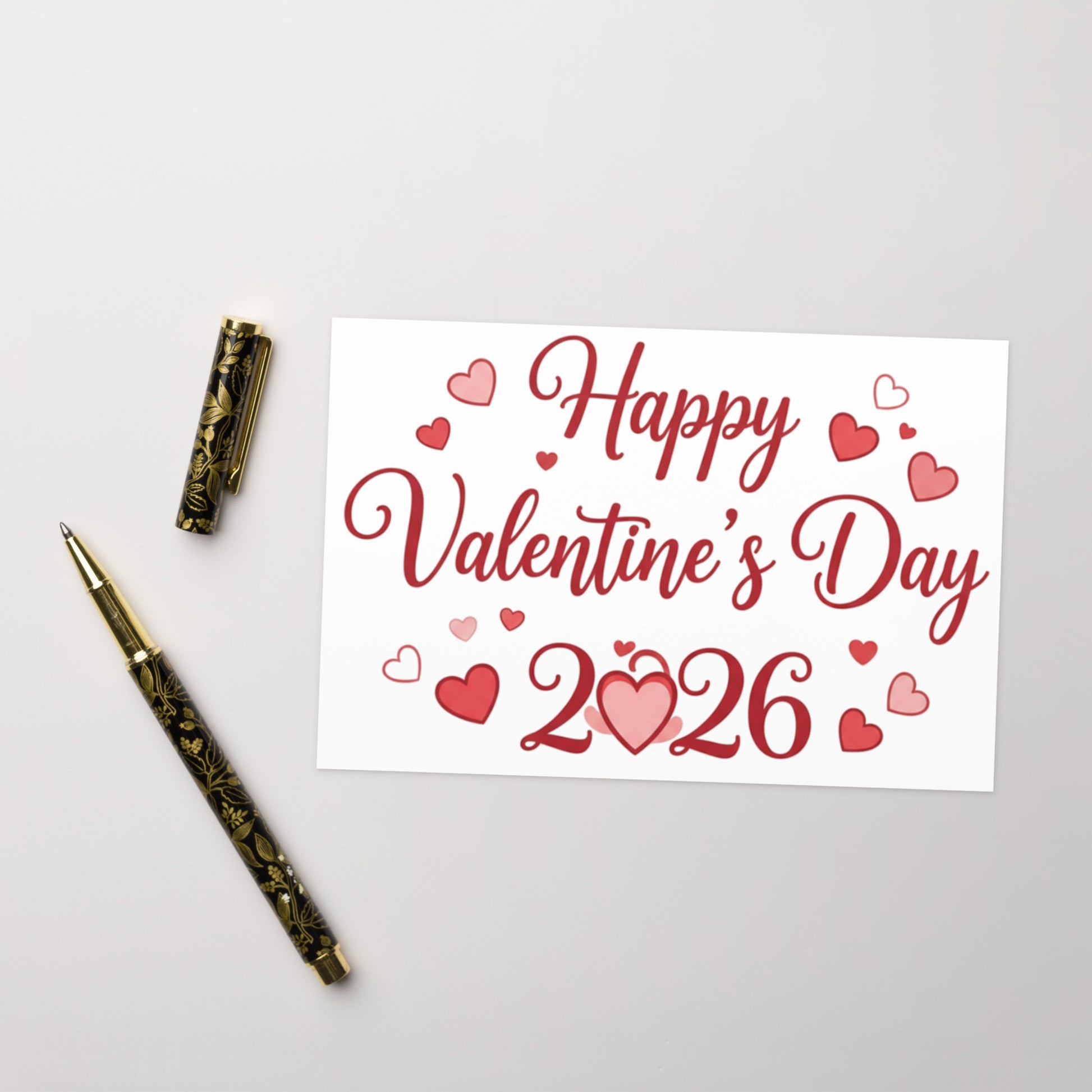 Valentine's Day card with 'Happy Valentine's Day 2026' text and decorative pen on a light gray background