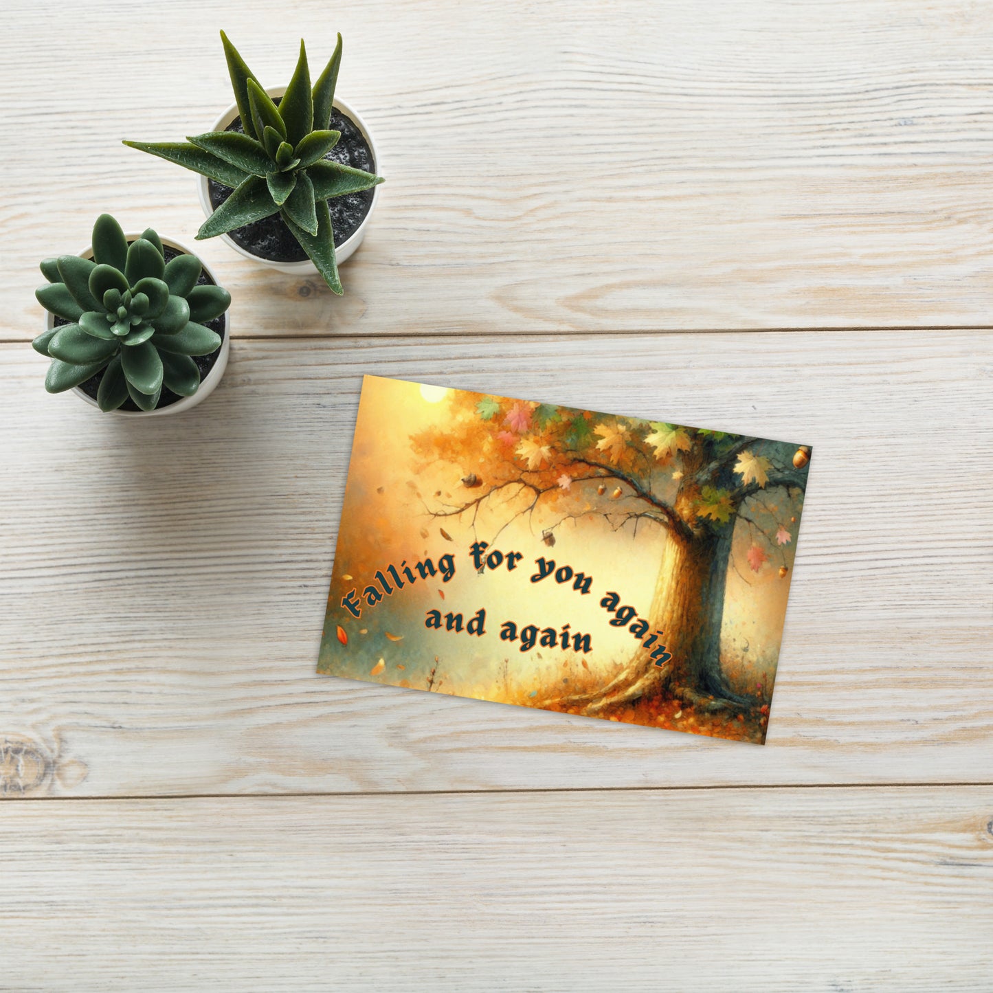 Card with 'Falling for you again and again' text on a wooden surface with plants.